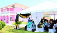 Crowd gathered on the picturesque grounds of the renovated administrator’s residence site for the rededication ceremony.