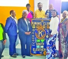 Pictured: Newly installed South Eleuthera Kewanis Club President Meredith Atwood (front center right of podium), stands with Kiwanis Dicision 22 lieutenant Governor Anastasia Johnson (fribnt center left of podium), along with South Eleuthera Kiwanis Club members, and with visiting guests.