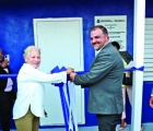 The cutting of the ceremonial ribbon by Minister Glenys Hanna-Martin, and Minister Clay Sweeting as BTVI president Dr. Linda Davis, and Housing Minister Keith Bell, look on.