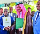 Prime Minister and Minister of Finance, the Hon. Philip Davis (center left), exchanges a handshake with His
Excellency Sultan Abdulrahman Al-marshad, Chief Executive officer, Saudi Fund for Development (center right), during
the signing ceremony for a $55 million loan agreement. Also seen is Deputy Prime Minister and Minister of tourism, Investments and Aviation, the Hon. Chester Cooper (end left), and Paul Bevans, Chairman, Airport Authority (end right).