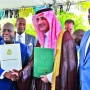 Prime Minister and Minister of Finance, the Hon. Philip Davis (center left), exchanges a handshake with His
Excellency Sultan Abdulrahman Al-marshad, Chief Executive officer, Saudi Fund for Development (center right), during
the signing ceremony for a $55 million loan agreement. Also seen is Deputy Prime Minister and Minister of tourism, Investments and Aviation, the Hon. Chester Cooper (end left), and Paul Bevans, Chairman, Airport Authority (end right).