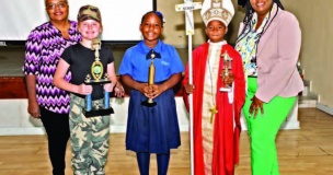 Winners stand with officials after a well-fought contest (L-R); Chief Judge Mrs. Althea Roberts, Sadie Pinder (1st Place), Keyanna Simon (2nd
Place), Timothy Morley (3rd Place), and DEO Mrs. Fontella Knowles.